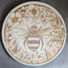 Houten pannenonderzetter met bloemen en bijtjes
